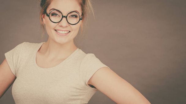 Happy teenage woman wearing eyeglasses - Fotoğraf, Görsel