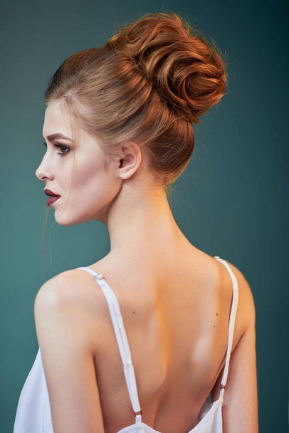 Beautiful sensual woman with elegant hairstyle. Perfect makeup. Fashion photo - 写真・画像