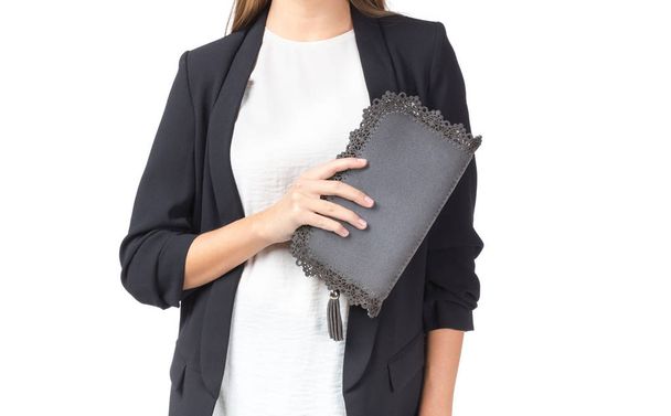 Woman holding a handbag isolated on white background - Photo, Image
