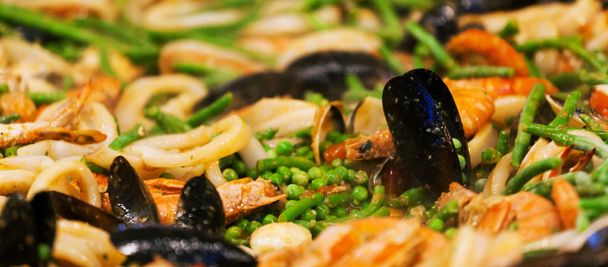 Seafood paella at the streetfood festival - Photo, Image