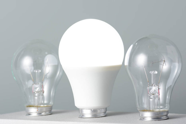 Glowing led lamp and incandescent bulbs - Photo, Image