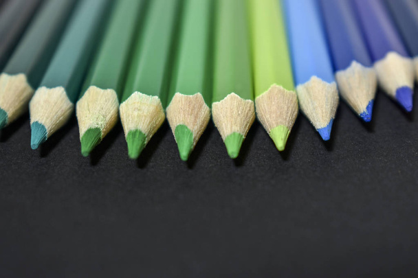colored pencils on black background - Φωτογραφία, εικόνα