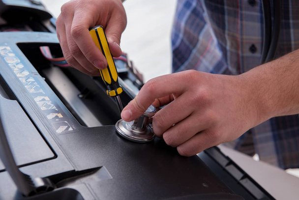 Repairman repairing broken color printer - Photo, Image