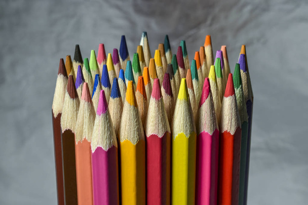 colored pencils on silver background - 写真・画像
