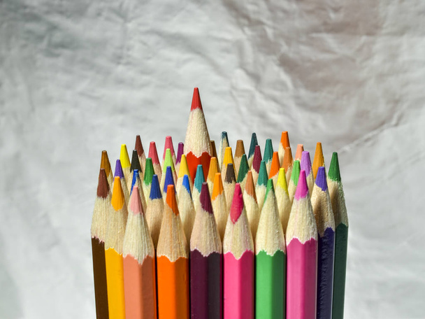 colored pencils on silver background - Foto, imagen