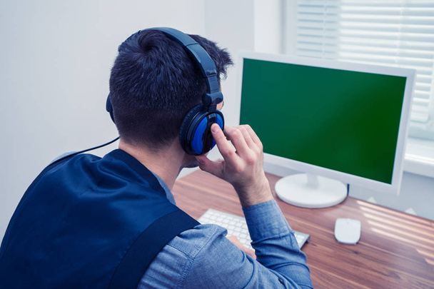handsome man in call center with headphones - Photo, Image