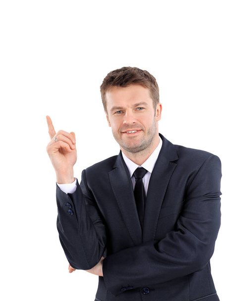 Smiling business man pointing on product or text. - Foto, Imagem