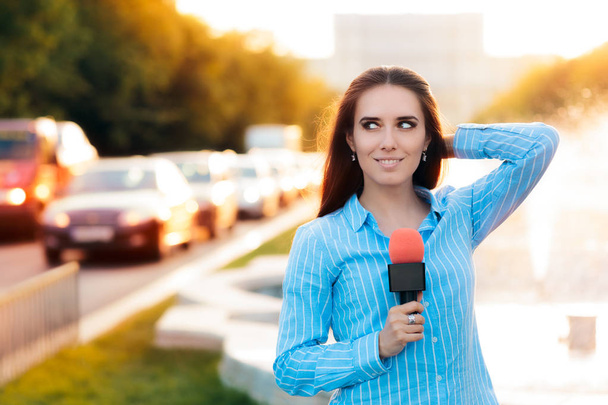 Female News Reporter on Field in Traffic  - Foto, Bild