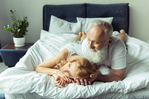 Mature couple in bed  - 写真・画像