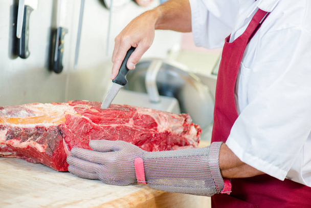 Butcher cutting meat and butcher - Foto, immagini