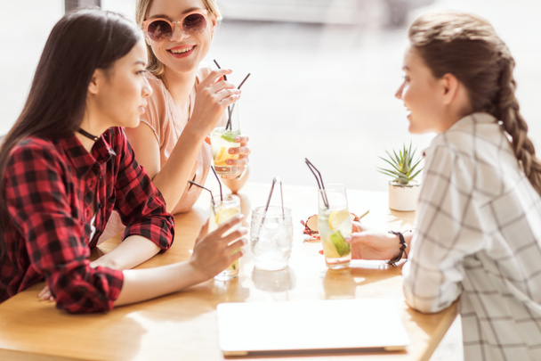 girls drinking cocktails in cafe - Photo, Image