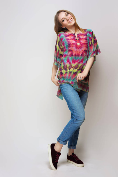 Pretty girl in rolled up jeans, gumshoes and colorful silk scarf - Foto, Imagem