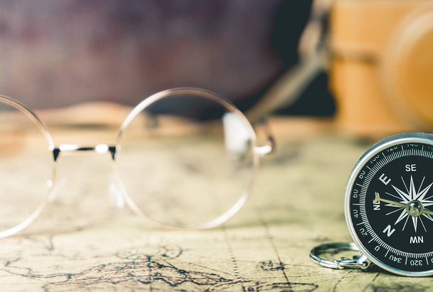 Vintage Glasses and Compass for explorer travel concept - Photo, image