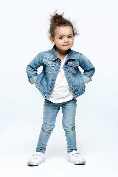 funny little kid girl in jeans - Фото, изображение