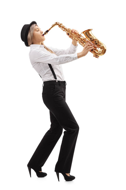Female jazz musician playing a saxophone - Фото, зображення