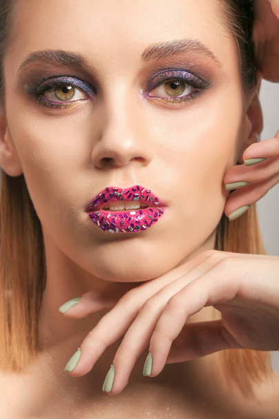 young woman with creative makeup - 写真・画像