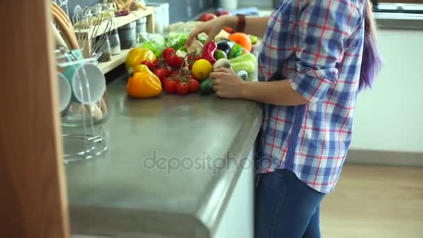 Young woman holding grocery shopping bag with vegetables - Footage, Video