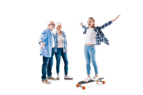 happy granddaughter with skateboard - Valokuva, kuva