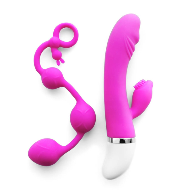 Vibrator and anal balls on white background - Фото, изображение