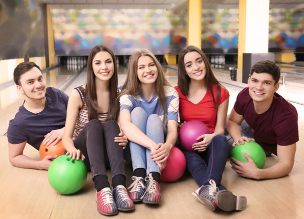 Friends having fun in bowling club - Photo, Image