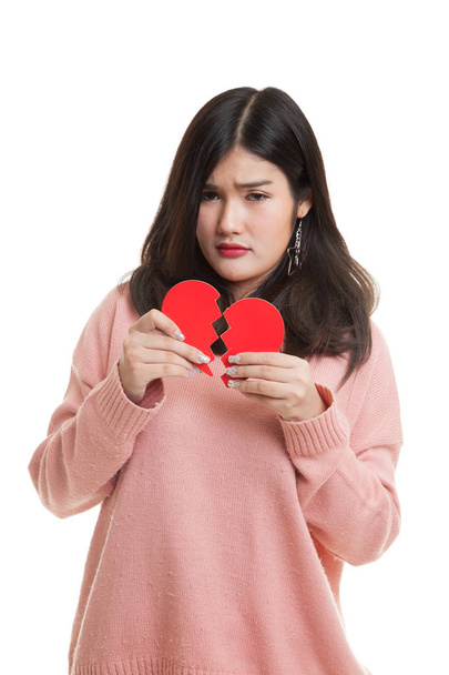 Beautiful young Asian woman with broken heart. - Фото, изображение