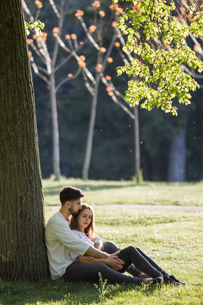 Young couple under tree - Фото, зображення