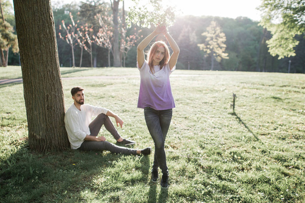Young couple under tree - Foto, Imagen