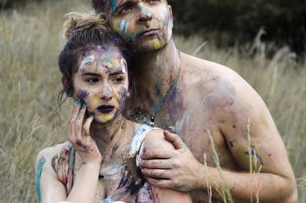 Young couple having fun with paints - Fotoğraf, Görsel