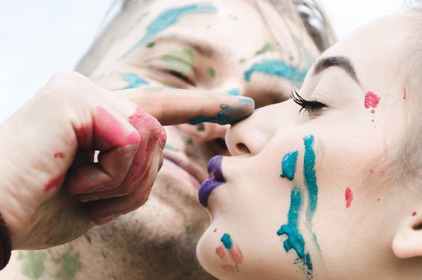 Young couple having fun with paints - Фото, зображення