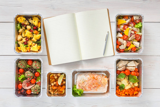 Healthy food take away in boxes, top view at wood - Zdjęcie, obraz