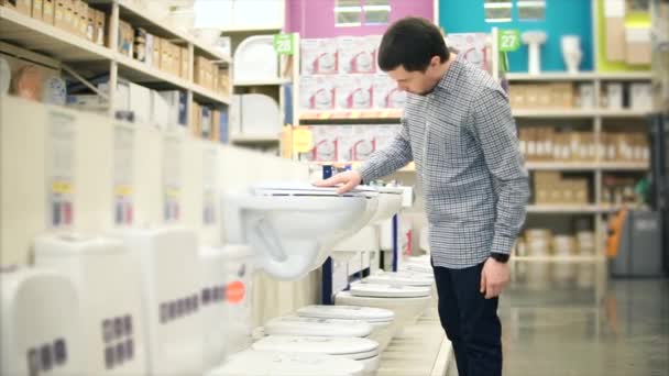 Man examining sanitary ware in the store - Footage, Video