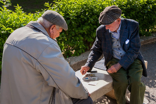 PALERMO, ITALY - October 14, 2009: Old people playing cards  - 写真・画像