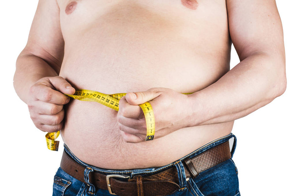 Thick mature man measuring his belly with a measuring tape, isol - Photo, Image