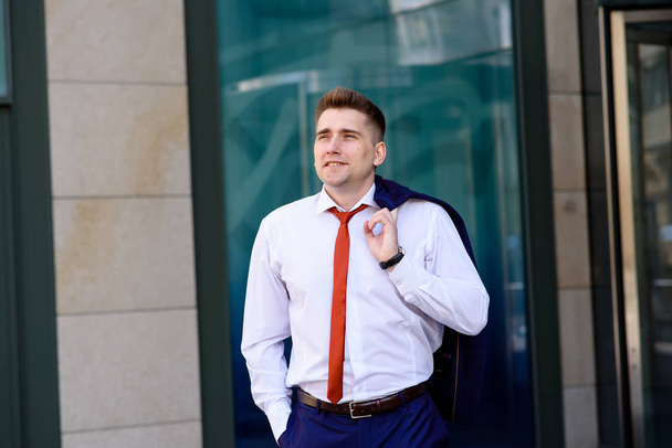 A successful businessman in a blue suit and Red tie. - Фото, изображение