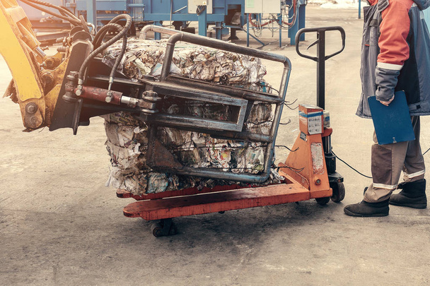 Forklift truck. Waste processing plant. Technological process. Recycling and storage of waste for further disposal. Business for sorting and processing of waste. - Photo, Image