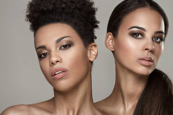 Beauty portrait of two african american girls. - Fotó, kép