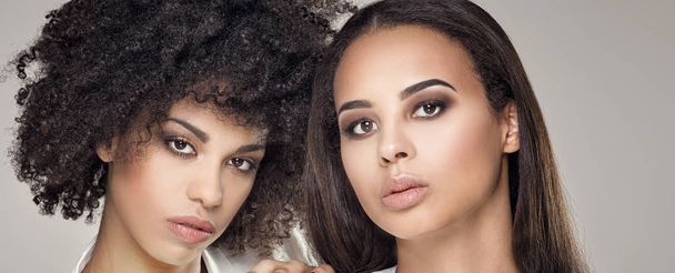 Beauty portrait of two african american girls. - Fotó, kép