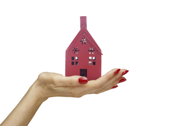 vrouwelijke hand bedrijf model home - Foto, afbeelding