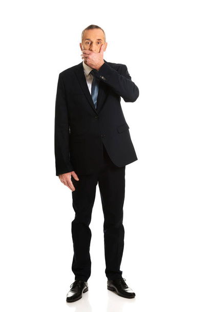Businessman covering his mouth - Foto, imagen