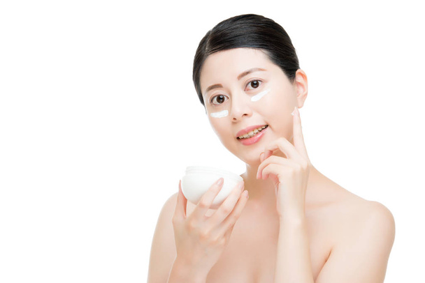 Smooth skin Chinese Asian girl use sun cream. - Fotó, kép