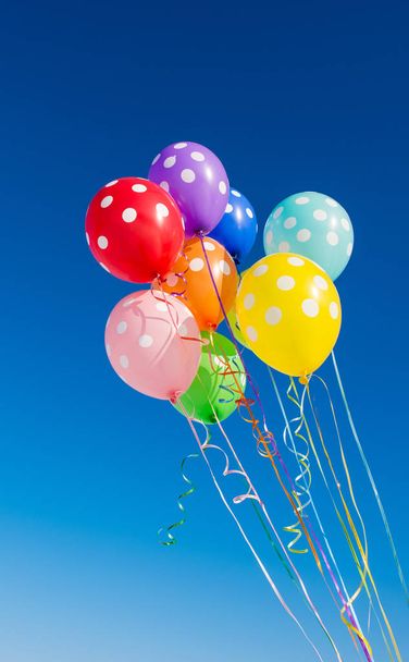 Balloons on a blue background - Foto, afbeelding