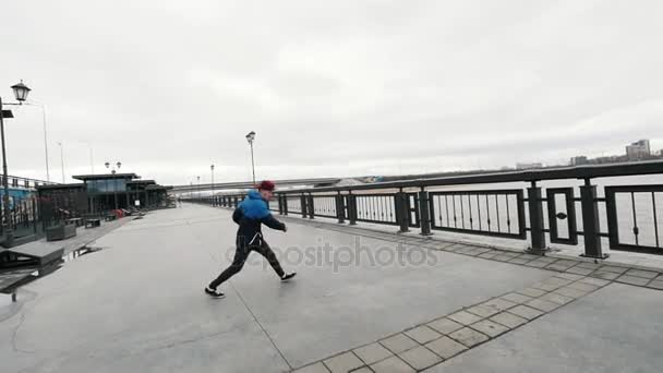 Slow-motion Acrobatics - teenager performing somersault outdoor - Materiaali, video