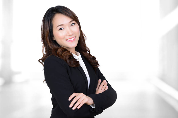 Young Asian businesswoman portrait on blur white background - Foto, afbeelding