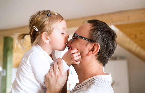Young father with his cute little daughter at home. - Fotoğraf, Görsel
