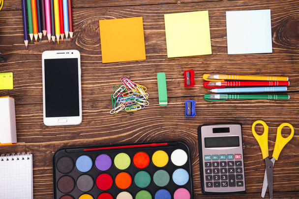 education, school supplies, close up of stationery and smartphon - Photo, Image