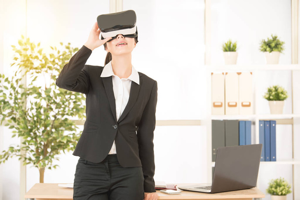 woman rest on working table with virtual reality - Photo, image