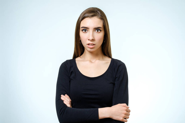 Young upset woman. Isolated on white background - Photo, image