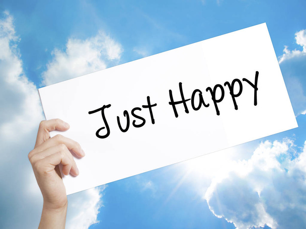 Just Happy Sign on white paper. Man Hand Holding Paper with text - Фото, изображение