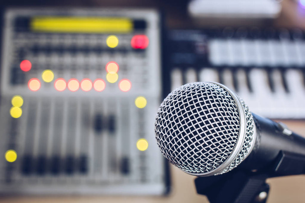 dynamic microphone on digital studio mixer background for music recording, radio / tv broadcasting concept - 写真・画像