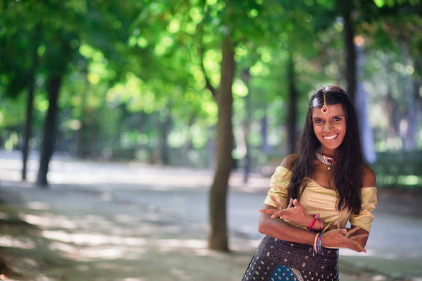 Young beautiful traditional indian woman outdoors - 写真・画像